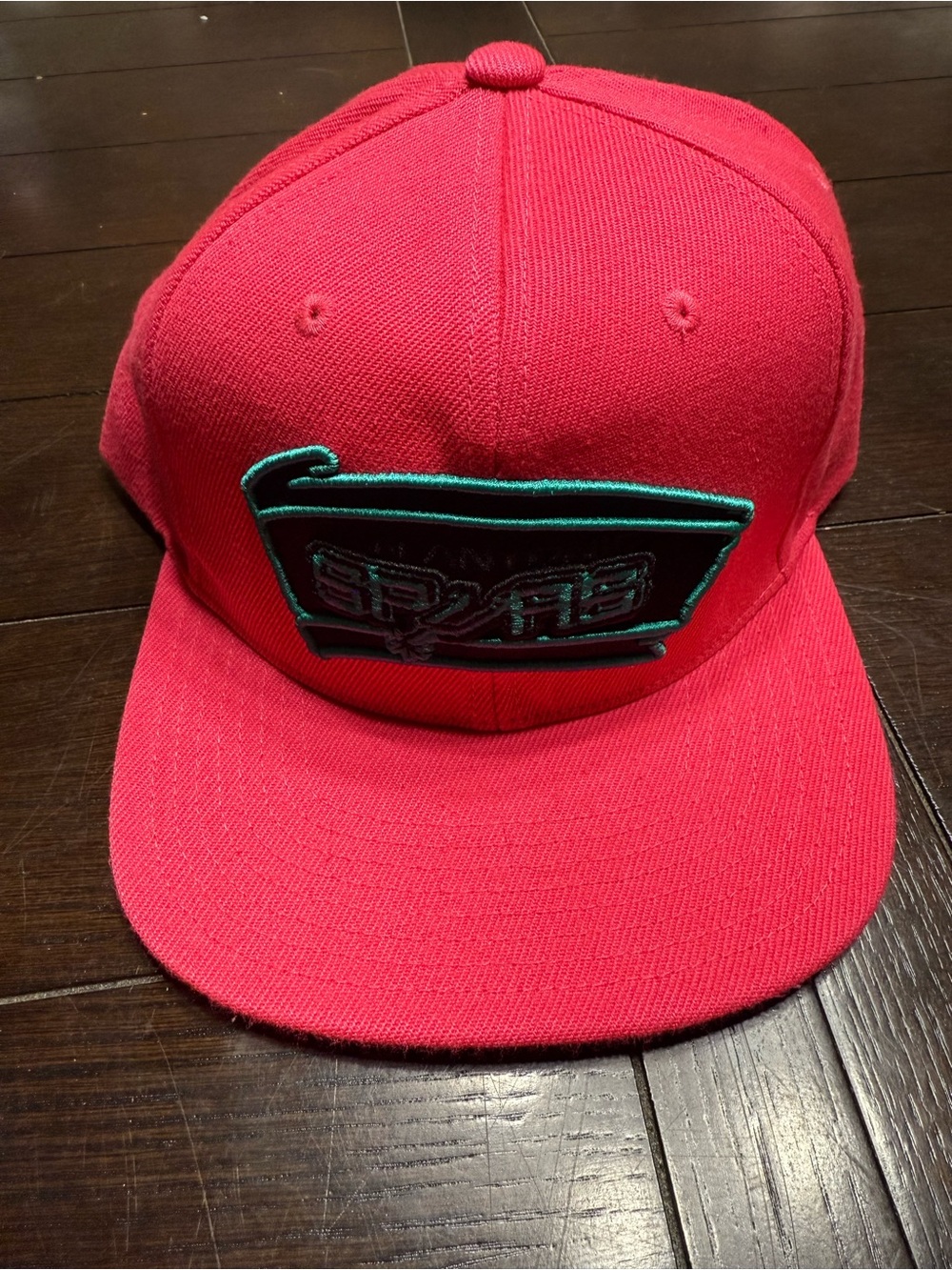 Pink Snapback Hat with Teal Logo Patch